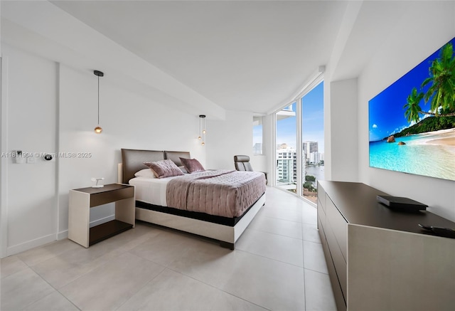 401 N Birch Rd Unit 1100, Fort Lauderdale, FL 33304 - bedroom featuring access to exterior, floor to ceiling windows, and light tile patterned flooring