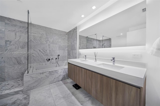 401 N Birch Rd Unit 1100, Fort Lauderdale, FL 33304 - bathroom featuring double vanity, a garden tub, and walk in shower
