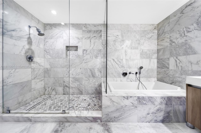 401 N Birch Rd Unit 1100, Fort Lauderdale, FL 33304 - bathroom with a garden tub, tiled shower, and vanity