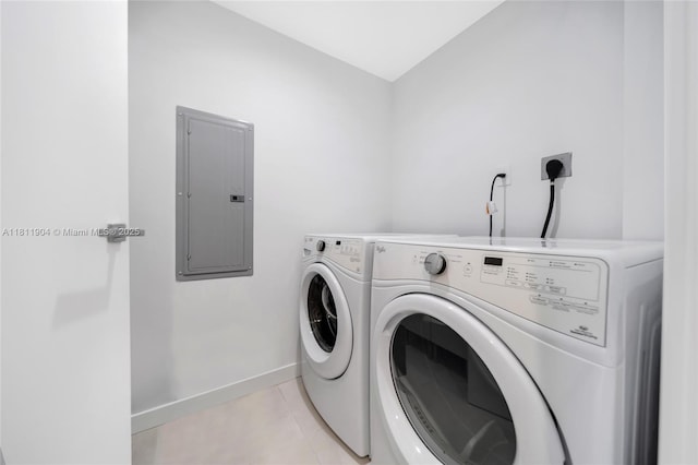 401 N Birch Rd Unit 1100, Fort Lauderdale, FL 33304 - laundry room with electric panel, washing machine and clothes dryer, and light tile patterned floors