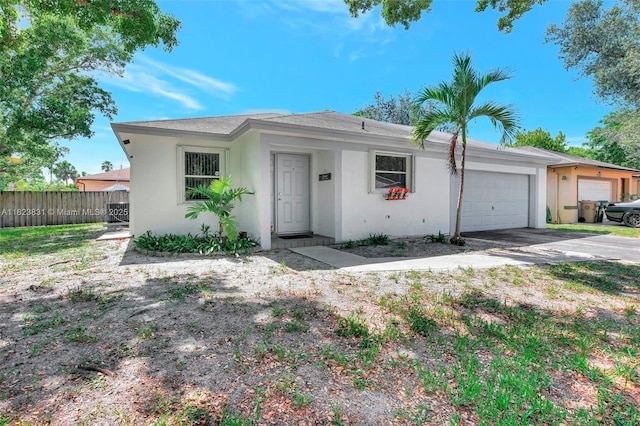1077 SW 120th Ave, Davie, FL 33325 - ranch-style home with an attached garage, stucco siding, and driveway