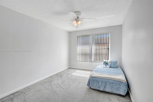 1077 SW 120th Ave, Davie, FL 33325 - carpeted bedroom featuring a textured ceiling and a ceiling fan