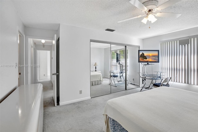 1077 SW 120th Ave, Davie, FL 33325 - bedroom featuring carpet, a textured ceiling, a closet, and a ceiling fan