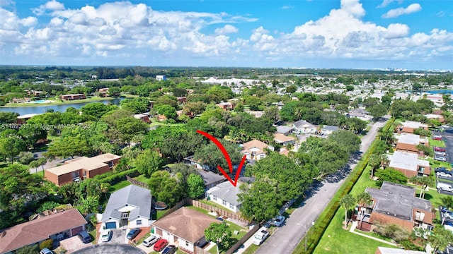1077 SW 120th Ave, Davie, FL 33325 - aerial perspective of suburban area with a nearby body of water and a tree filled landscape