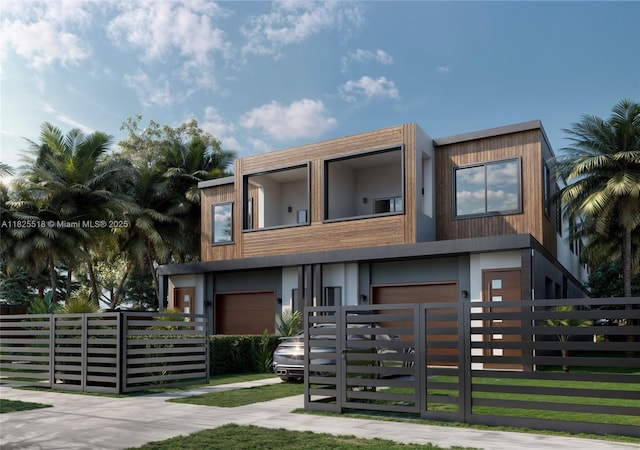 3187 SW 23rd St Unit A, Miami, FL 33145 - contemporary home featuring a fenced front yard, a balcony, and an attached garage
