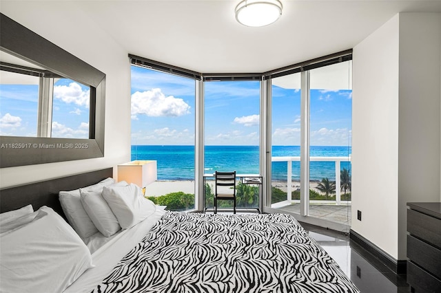 4779 Collins Ave Unit 702, Miami Beach, FL 33140 - bedroom featuring floor to ceiling windows, a water view, multiple windows, and access to outside