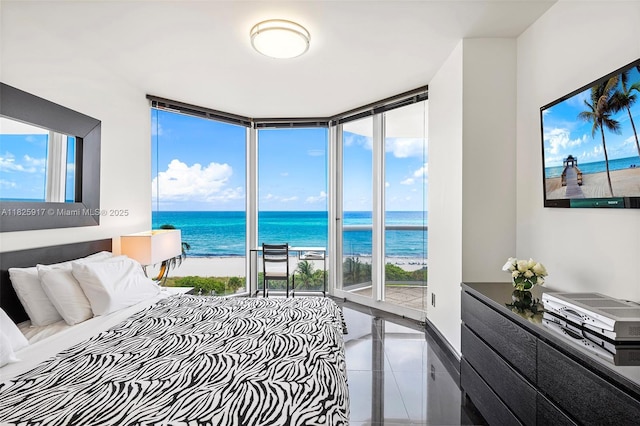 4779 Collins Ave Unit 702, Miami Beach, FL 33140 - bedroom with expansive windows and tile patterned flooring