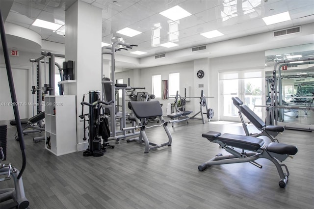4779 Collins Ave Unit 702, Miami Beach, FL 33140 - gym with wood finished floors and a drop ceiling