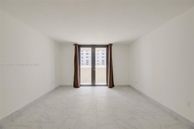 1621 Collins Ave Unit 708, Miami Beach, FL 33139 - unfurnished room featuring light marble finish flooring