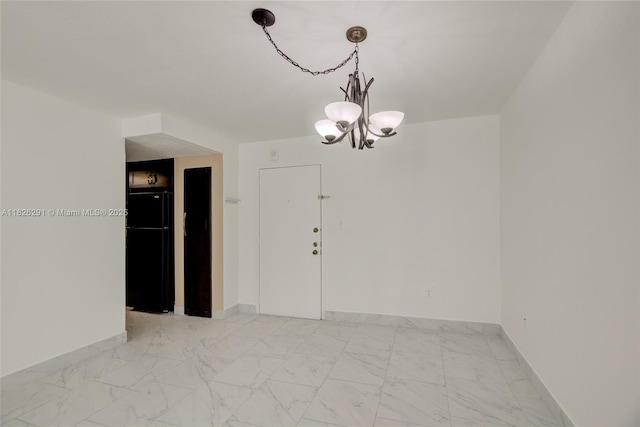 1621 Collins Ave Unit 708, Miami Beach, FL 33139 - spare room with a chandelier and light marble finish flooring