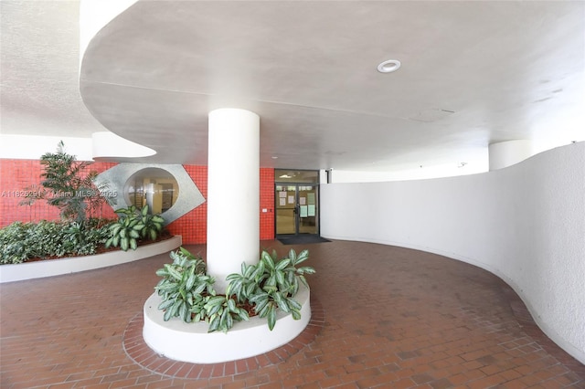 1621 Collins Ave Unit 708, Miami Beach, FL 33139 - corridor featuring brick floors