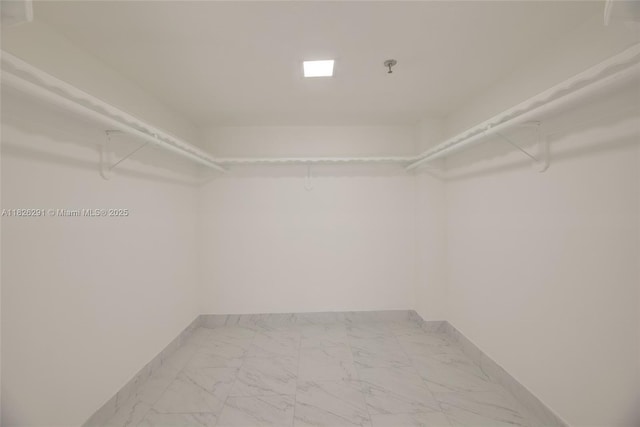 1621 Collins Ave Unit 708, Miami Beach, FL 33139 - spacious closet with marble look tile flooring