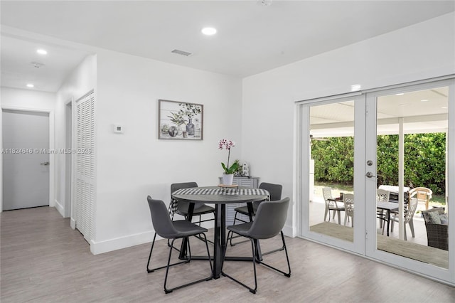 5290 Palm Ave, Hialeah, FL 33012 - dining area with french doors, light wood-style floors, and recessed lighting