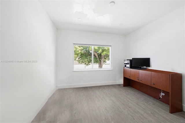 5290 Palm Ave, Hialeah, FL 33012 - bedroom featuring light wood finished floors and baseboards