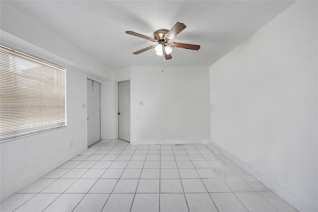 5290 Palm Ave, Hialeah, FL 33012 - empty room with ceiling fan and light tile patterned floors