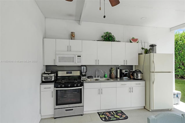 5290 Palm Ave, Hialeah, FL 33012 - kitchen featuring white appliances, ceiling fan, white cabinets, and backsplash