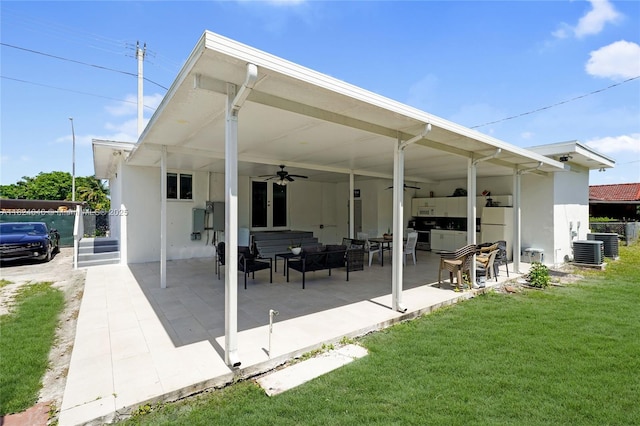 5290 Palm Ave, Hialeah, FL 33012 - rear view of house featuring a ceiling fan, a patio area, an outdoor hangout area, and stucco siding