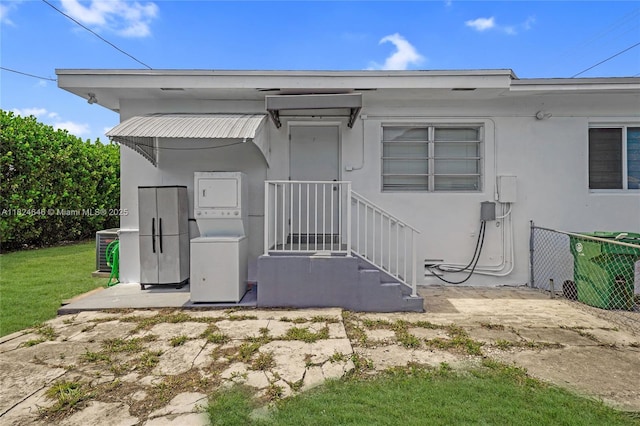 5290 Palm Ave, Hialeah, FL 33012 - view of front of home with stucco siding and washer / dryer