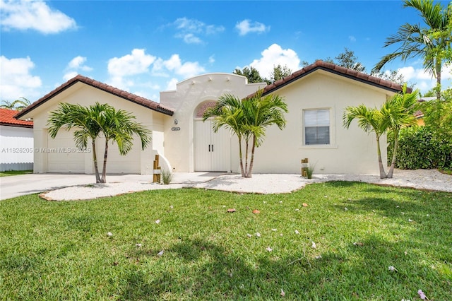 14711 SW 170th Ter, Miami, FL 33187 - mediterranean / spanish house with stucco siding, a front lawn, and a tiled roof