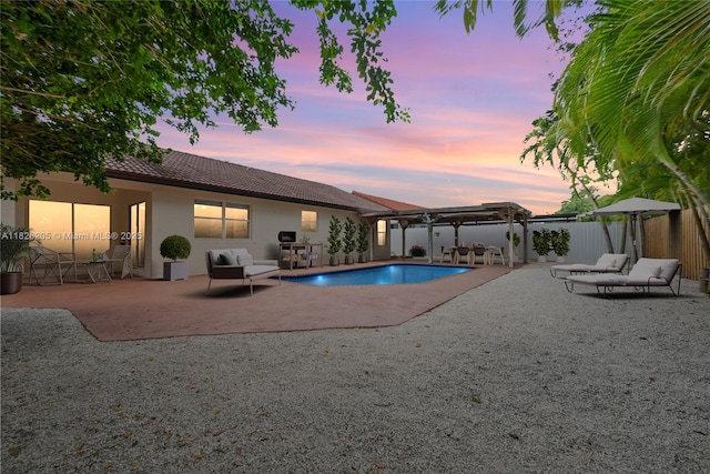 14711 SW 170th Ter, Miami, FL 33187 - pool at dusk with a pergola and a patio
