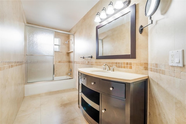 14711 SW 170th Ter, Miami, FL 33187 - full bath with tile walls, combined bath / shower with glass door, vanity, and tile patterned floors