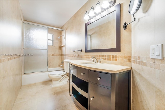14711 SW 170th Ter, Miami, FL 33187 - full bathroom featuring tile walls, combined bath / shower with glass door, vanity, and tile patterned flooring