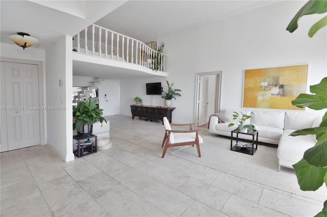 6770 Indian Creek Dr Unit Te, Miami Beach, FL 33141 - living area featuring a high ceiling and stone tile floors