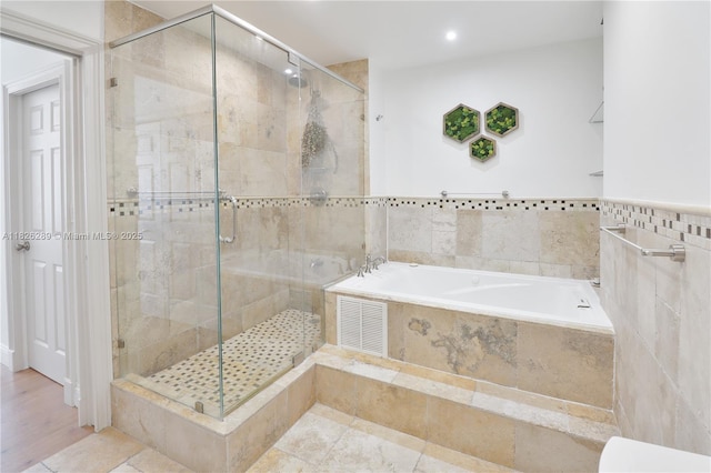 6770 Indian Creek Dr Unit Te, Miami Beach, FL 33141 - bathroom featuring a garden tub, a stall shower, recessed lighting, and tile patterned flooring