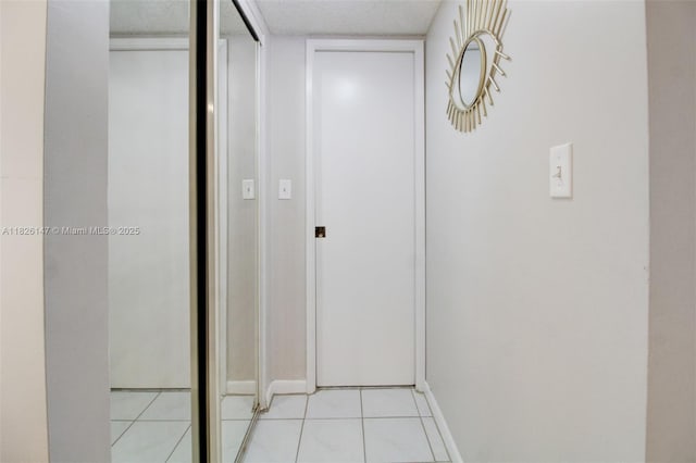 15549 N Miami Lakeway N Unit 104, Miami Lakes, FL 33014 - hallway with light tile patterned floors and baseboards