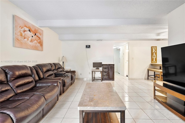 1125 S Flagler Ave Unit 511, Pompano Beach, FL 33060 - living room with light tile patterned floors, beam ceiling, and a textured ceiling
