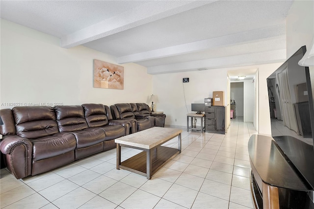 1125 S Flagler Ave Unit 511, Pompano Beach, FL 33060 - living room with beamed ceiling, light tile patterned flooring, and a textured ceiling