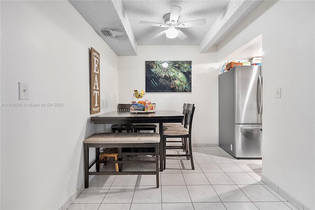 1125 S Flagler Ave Unit 511, Pompano Beach, FL 33060 - dining area with a textured ceiling, ceiling fan, and light tile patterned flooring