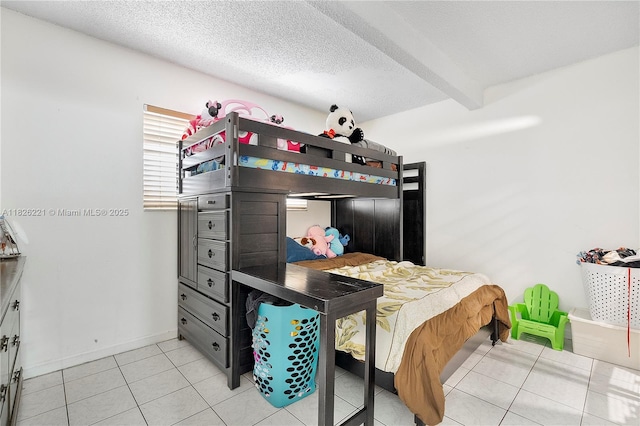 1125 S Flagler Ave Unit 511, Pompano Beach, FL 33060 - bedroom featuring light tile patterned flooring, beamed ceiling, and a textured ceiling