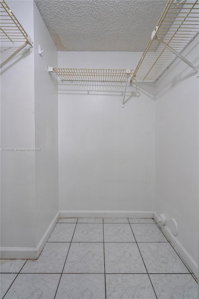 1125 S Flagler Ave Unit 511, Pompano Beach, FL 33060 - walk in closet with light tile patterned floors