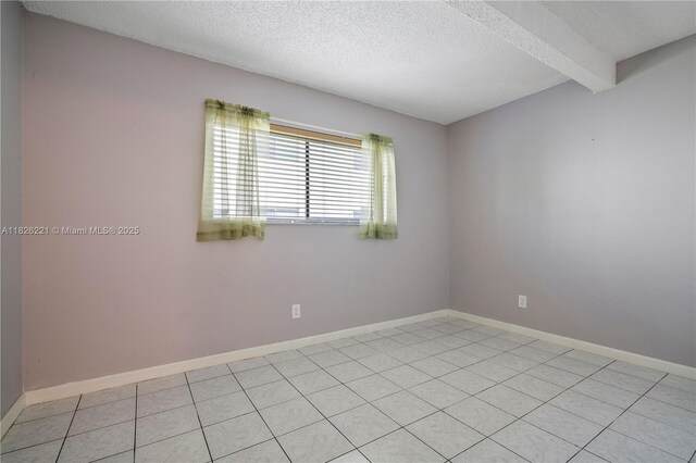 1125 S Flagler Ave Unit 511, Pompano Beach, FL 33060 - unfurnished room with a textured ceiling and beam ceiling