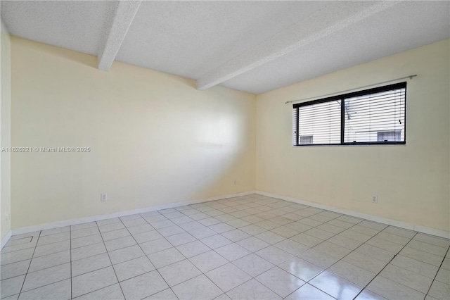 1125 S Flagler Ave Unit 511, Pompano Beach, FL 33060 - unfurnished room with a textured ceiling, beamed ceiling, and light tile patterned flooring