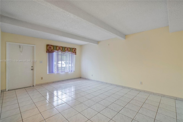 1125 S Flagler Ave Unit 511, Pompano Beach, FL 33060 - empty room featuring a textured ceiling, beam ceiling, and light tile patterned flooring