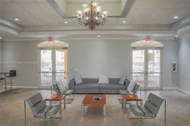 7200 NW 114th Ave Unit 305, Doral, FL 33178 - living area featuring french doors, a raised ceiling, plenty of natural light, ornamental molding, and recessed lighting