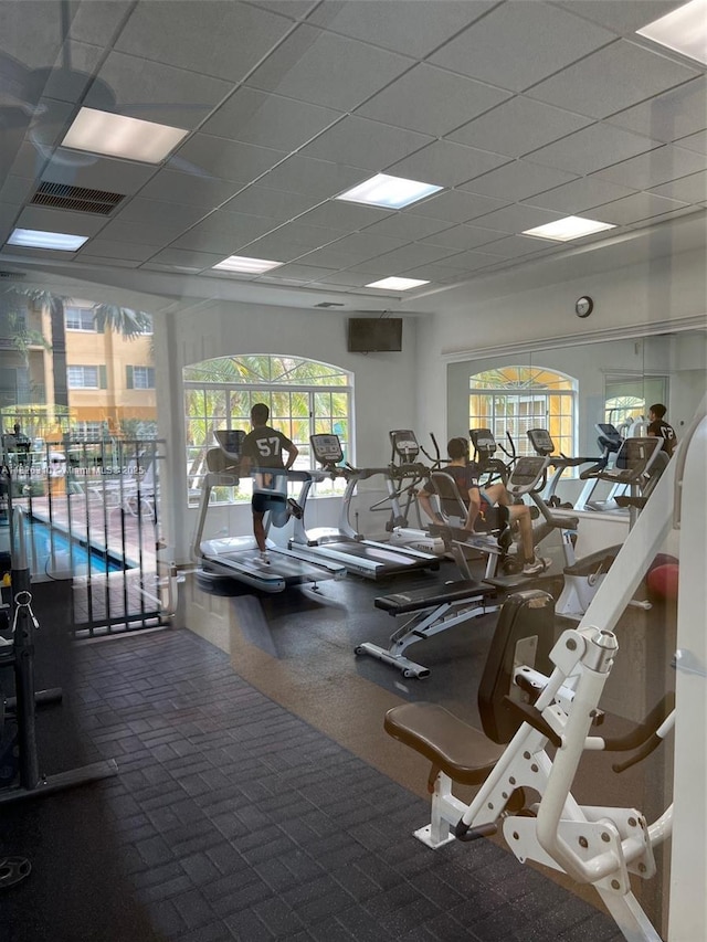 7200 NW 114th Ave Unit 305, Doral, FL 33178 - gym featuring a paneled ceiling