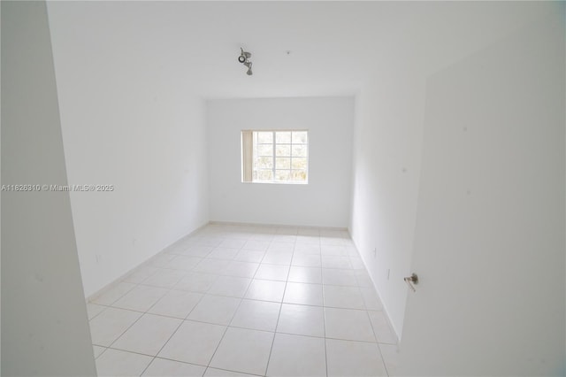 7200 NW 114th Ave Unit 305, Doral, FL 33178 - unfurnished room with light tile patterned flooring