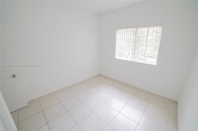 7200 NW 114th Ave Unit 305, Doral, FL 33178 - unfurnished room featuring light tile patterned flooring