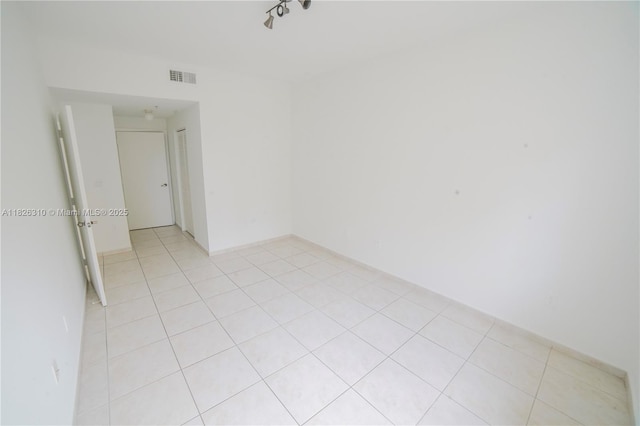 7200 NW 114th Ave Unit 305, Doral, FL 33178 - unfurnished room featuring light tile patterned flooring