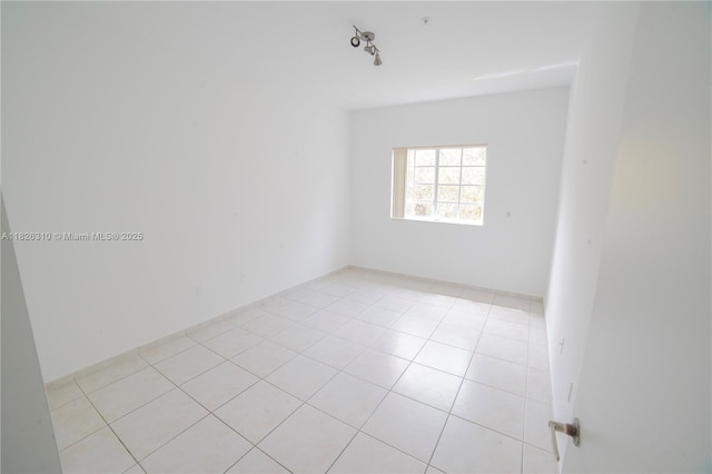 7200 NW 114th Ave Unit 305, Doral, FL 33178 - empty room with light tile patterned flooring