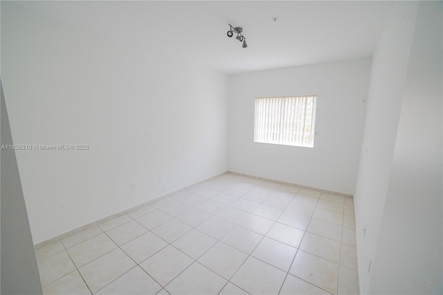 7200 NW 114th Ave Unit 305, Doral, FL 33178 - spare room featuring light tile patterned floors