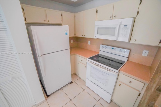 7200 NW 114th Ave Unit 305, Doral, FL 33178 - kitchen featuring white appliances, light countertops, and light tile patterned flooring