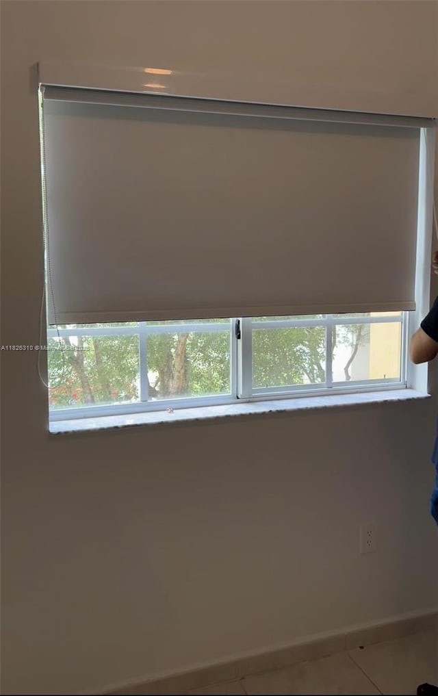 7200 NW 114th Ave Unit 305, Doral, FL 33178 - tiled spare room with baseboards