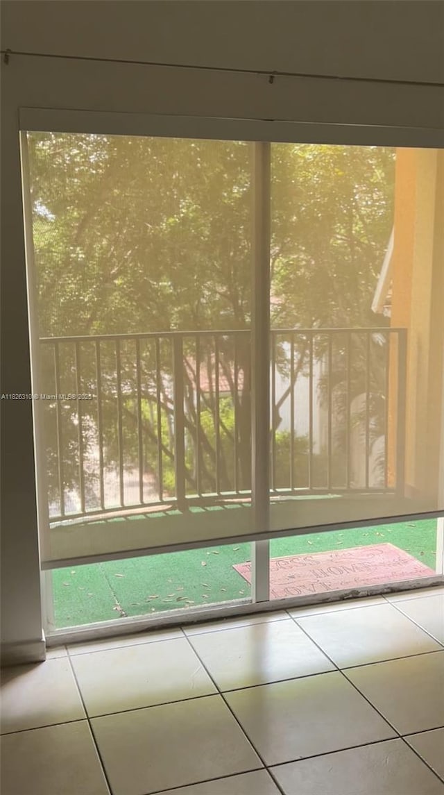 7200 NW 114th Ave Unit 305, Doral, FL 33178 - doorway to outside featuring tile patterned floors