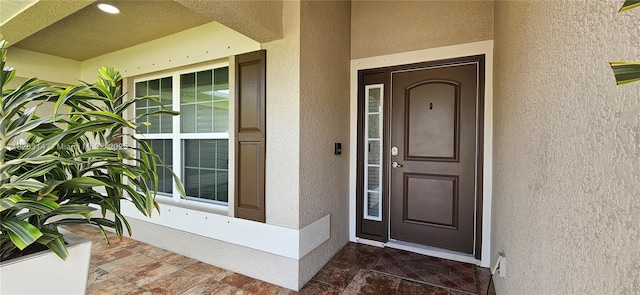 1948 Redmont Ave, Lehigh Acres, FL 33972 - view of exterior entry featuring stucco siding