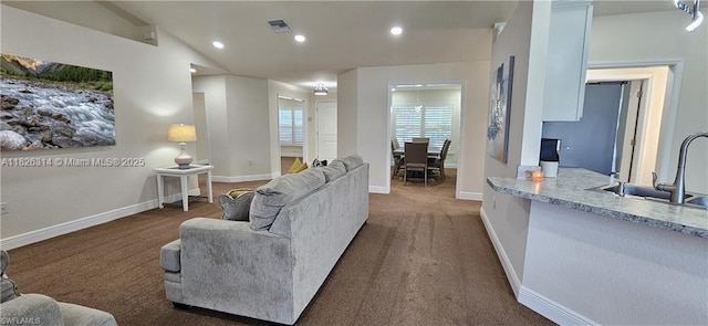 1948 Redmont Ave, Lehigh Acres, FL 33972 - living area with recessed lighting, dark colored carpet, and vaulted ceiling