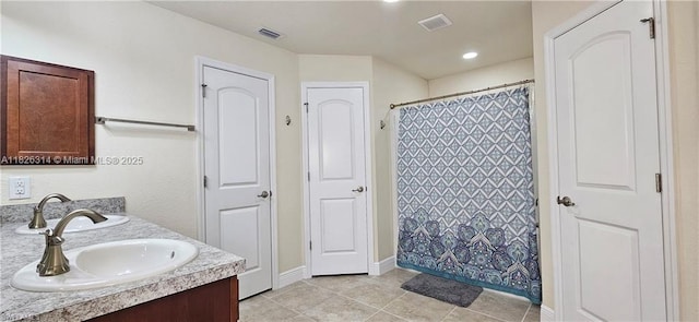 1948 Redmont Ave, Lehigh Acres, FL 33972 - full bath featuring double vanity, tile patterned floors, and a shower with curtain